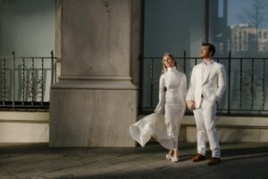 wedding photo of a couple wearing all white